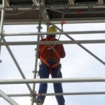 Worker on a scaffold Man on Scaffolding